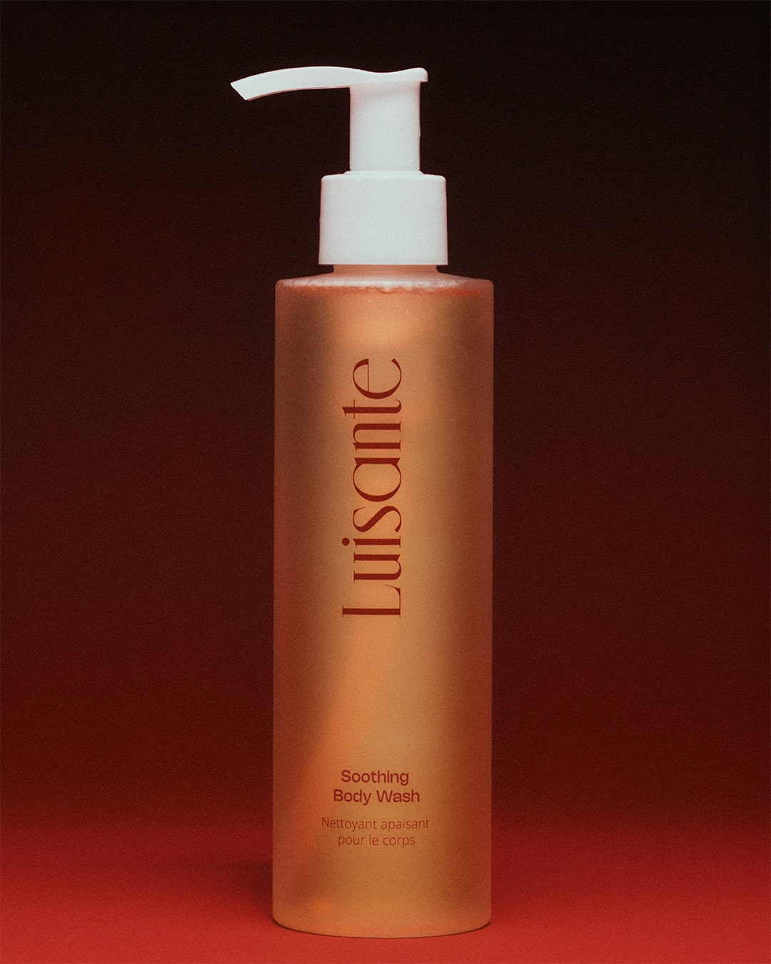 Luisante soothing body wash for all skin types in a tall frosted bottle with white pump
